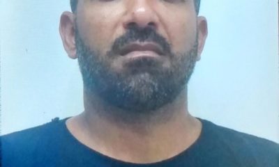 Imagem de um miliciano preso por policiais militares