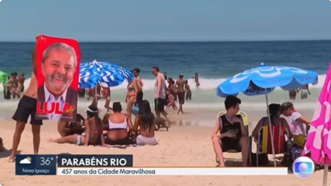 Banhista exibe toalha com rosto de Lula ao vivo na Globo